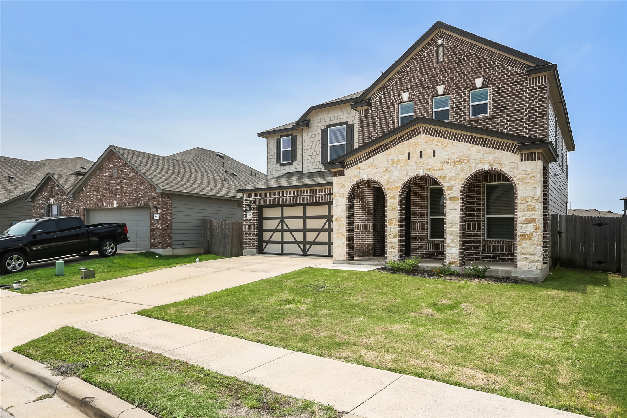 18917 Rushmore Street Manor, TX 78653 - Photo 27 of 28 a front view of a house with a yard