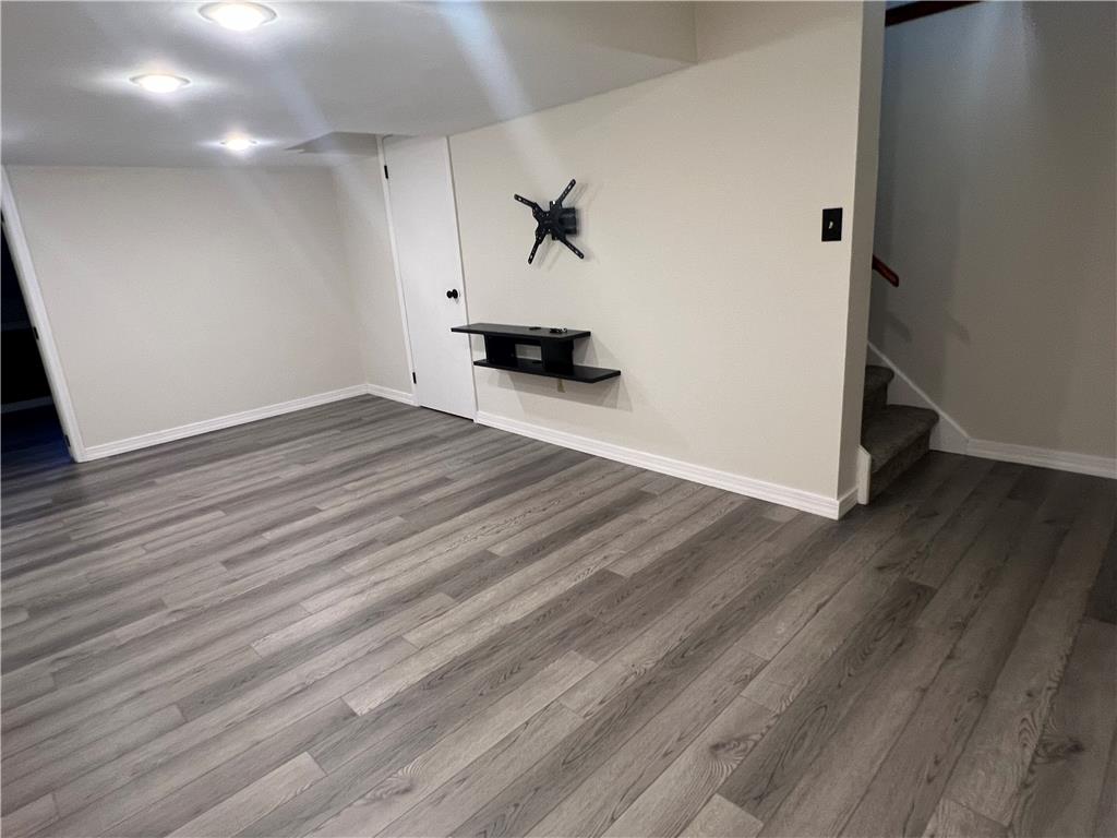 896 Briarstone Road Bethlehem, PA 18017 - Photo 31 of 37 Vinyl plank flooring and integrated recessed lighting define this versatile lower-level space.