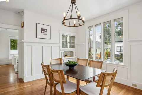 a kitchen with stainless steel appliances a refrigerator a stove a sink and a window