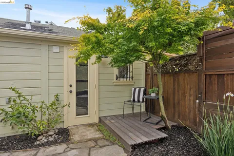 a side view of a house with a yard