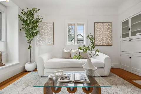 a living room with furniture a rug and a fireplace
