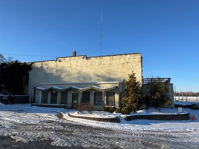 a view of a house with backyard porch and sitting area