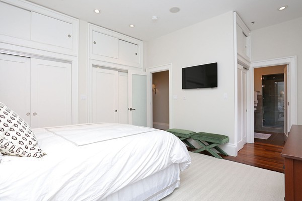 32 Rutland Street, Unit 2L Boston, MA 02118 - Photo 12 of 22 a spacious bedroom with a bed and a flat screen tv