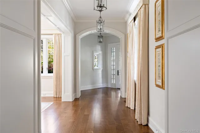 a living room with furniture a fireplace and a large window