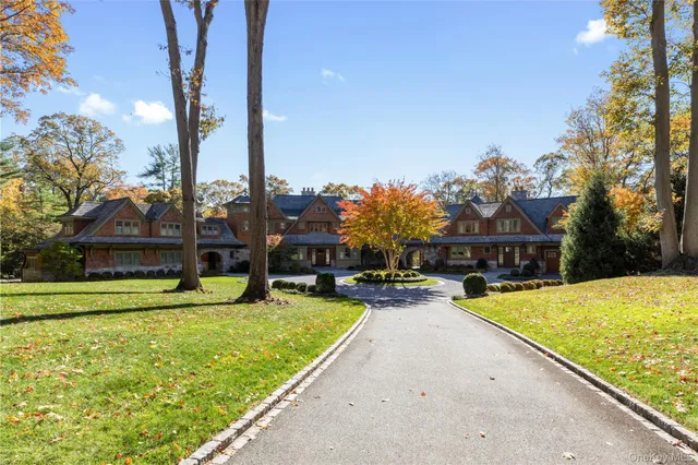 a view of a house with swimming pool and a yard