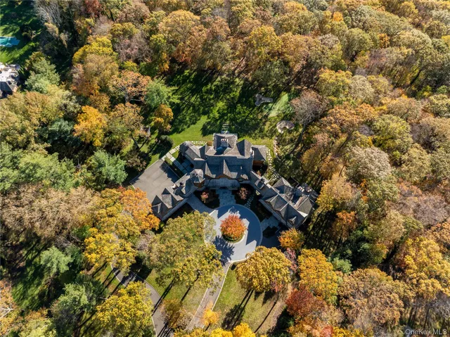a front view of a residential apartment building with a yard