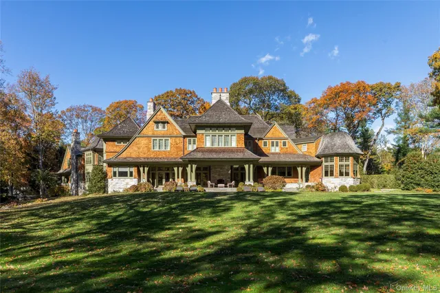 a building outdoor space with patio furniture and potted plants