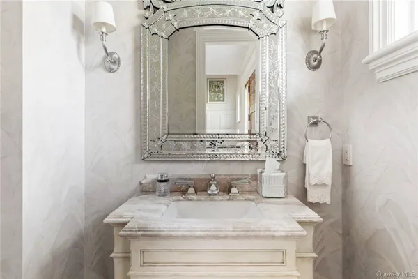 a view of a dining room with furniture a chandelier and wooden floor