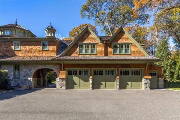 a front view of a house with garage