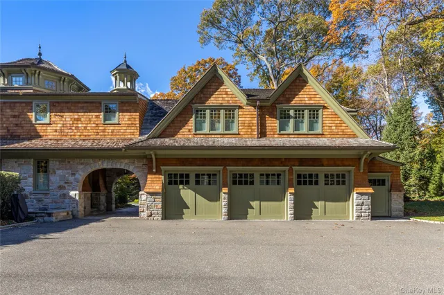 a front view of a house with garage