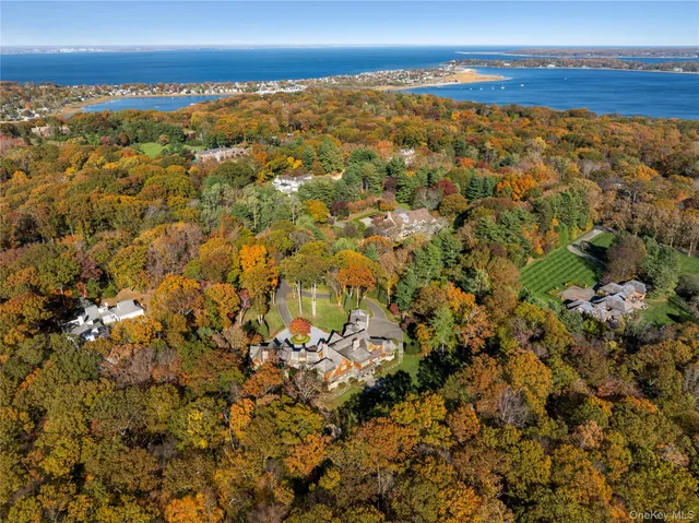 a view of hall way with furniture and fireplace