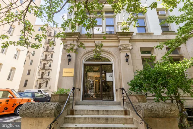 a view of street with parked cars