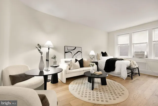 a living room with furniture and a window