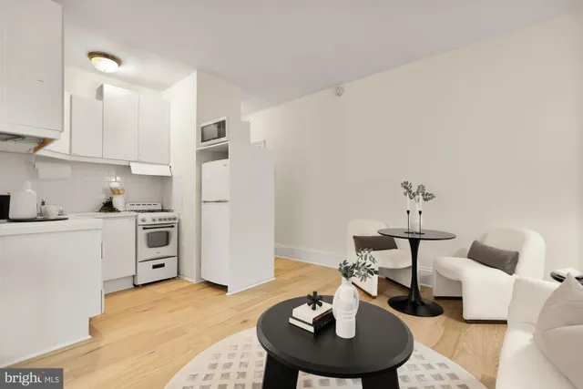 a kitchen with stainless steel appliances a sink and a refrigerator