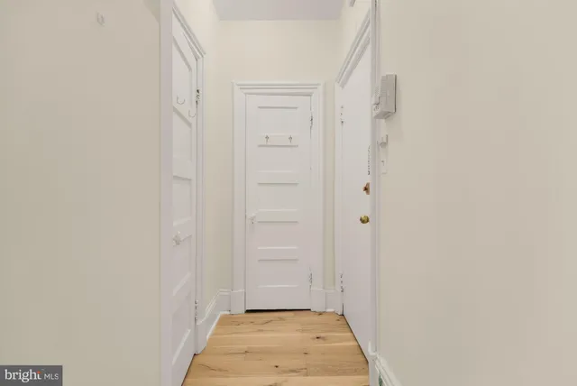 a view of room with cabinet and shelf