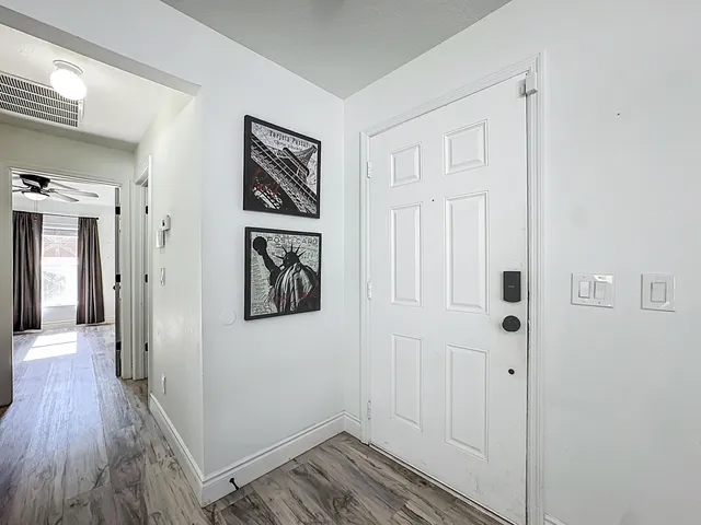 a view of a dining room with furniture and wooden floor