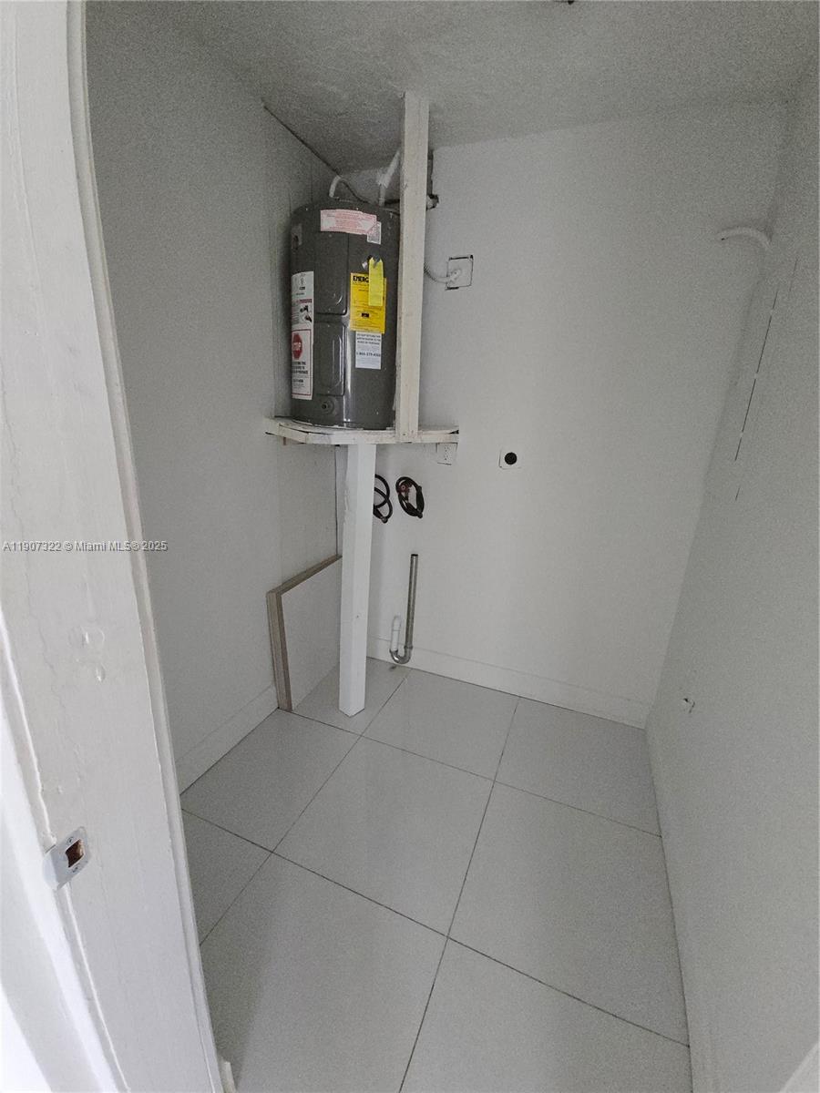 2650 Northwest 60th Way, Unit 176 Sunrise, FL 33313 - Photo 14 of 20 a view of a bathroom from a hallway