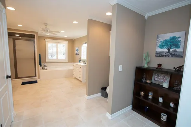 a spacious bathroom with a double vanity sink a mirror and a bathtub