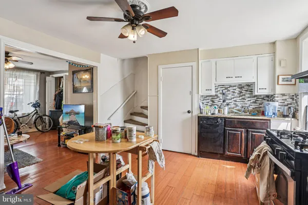 a kitchen with stainless steel appliances granite countertop a stove and a sink