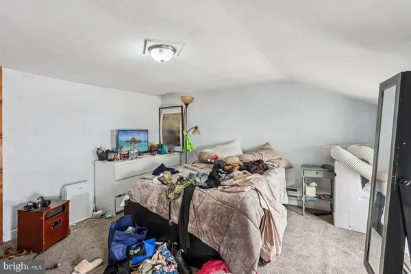 a bed room with a bed and a tv