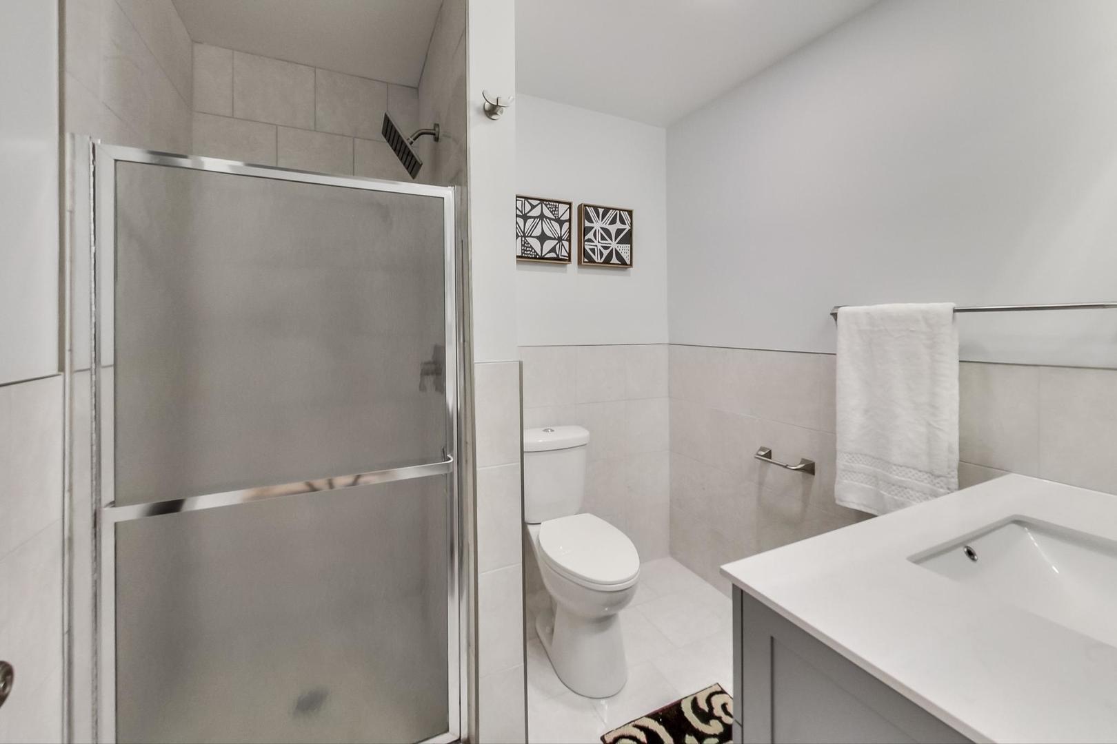 1422 West Lexington Street, Unit 2F Chicago, IL 60607 - Photo 11 of 19 a bathroom with a sink a toilet and shower
