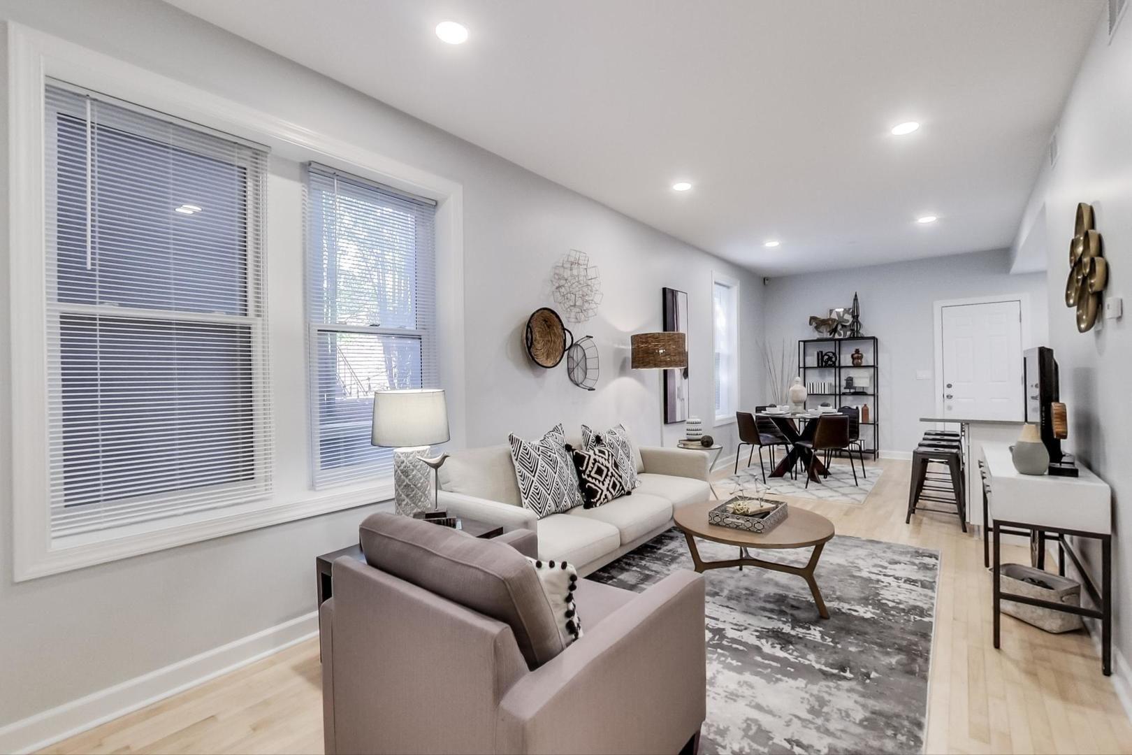 1422 West Lexington Street, Unit 2F Chicago, IL 60607 - Photo 3 of 19 a living room with furniture and a large window