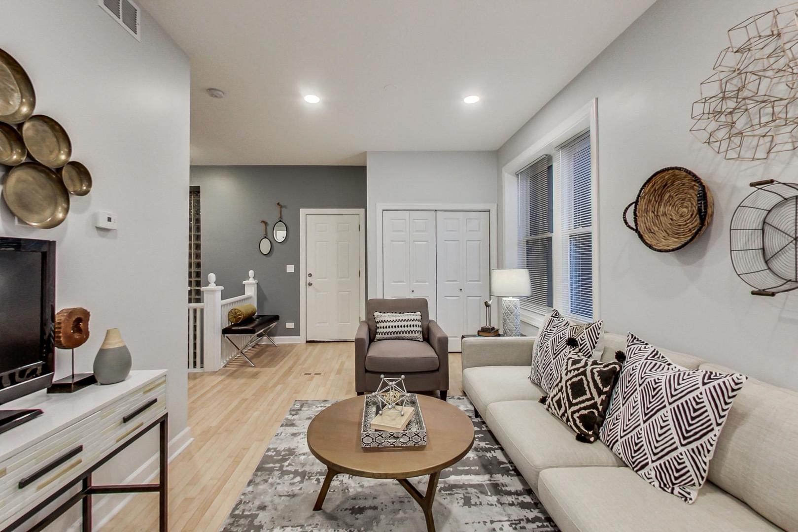 1422 West Lexington Street, Unit 2F Chicago, IL 60607 - Photo 4 of 19 a living room with furniture and a large window