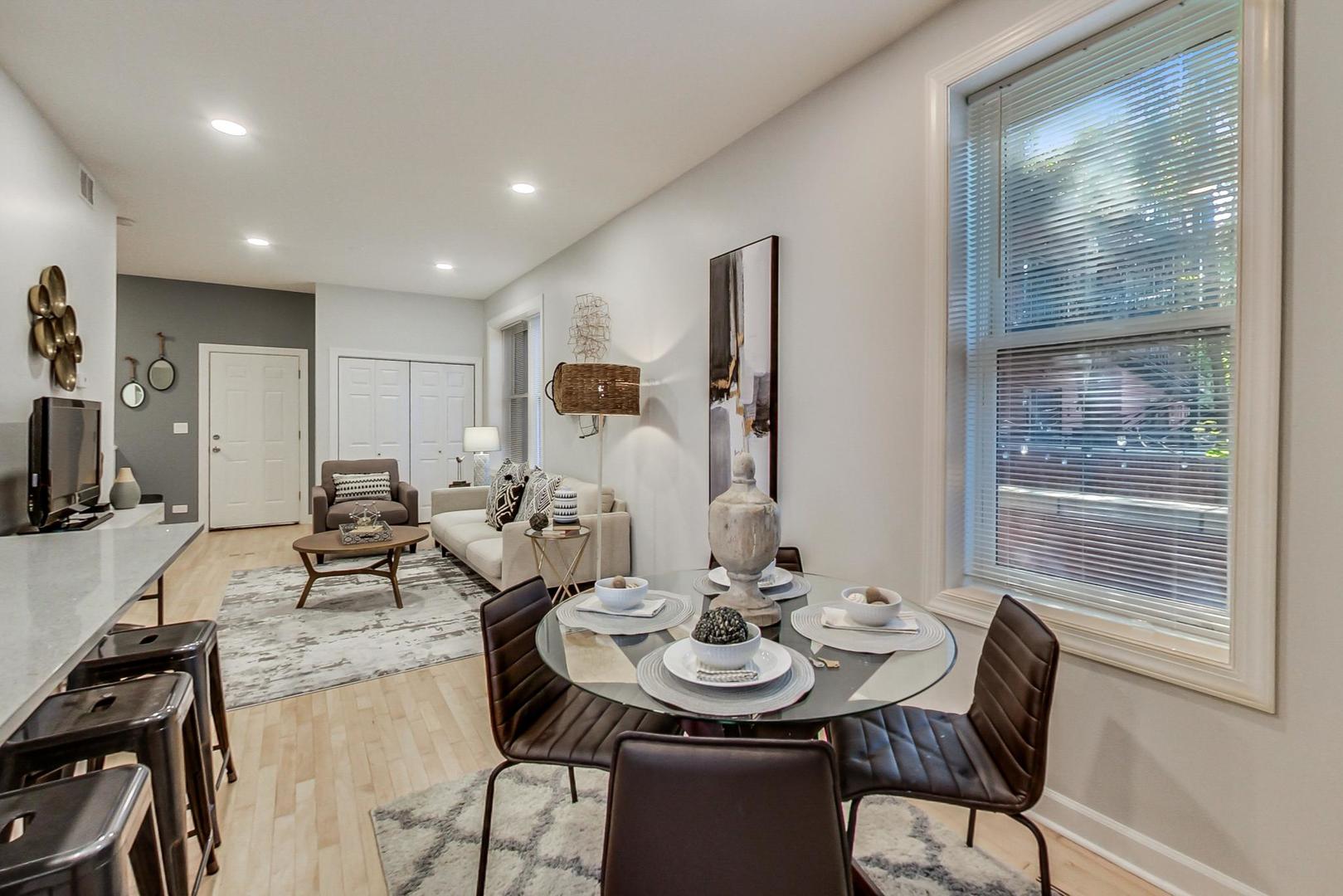1422 West Lexington Street, Unit 2F Chicago, IL 60607 - Photo 5 of 19 a view of a dining room with furniture and wooden floor