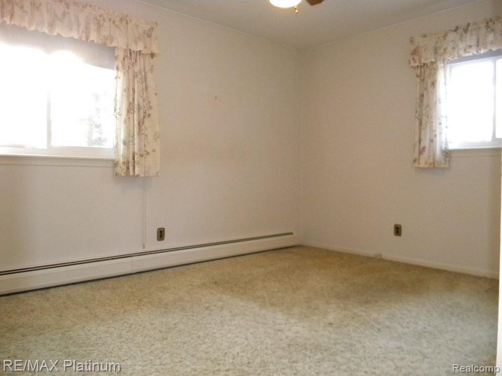 850 North Latson Road Howell, MI 48843 - Photo 17 of 25 MASTER BEDROOM W/ PRVT BATH