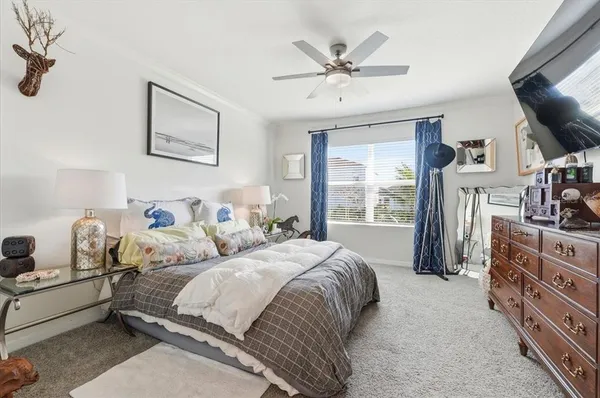 a bedroom with a bed and window