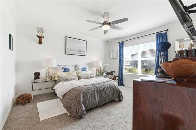 a bedroom with a bed and flat screen tv
