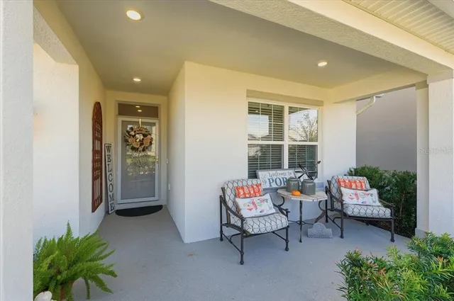 a backyard of a house with outdoor seating