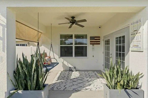 a front view of a house with a yard table and chairs