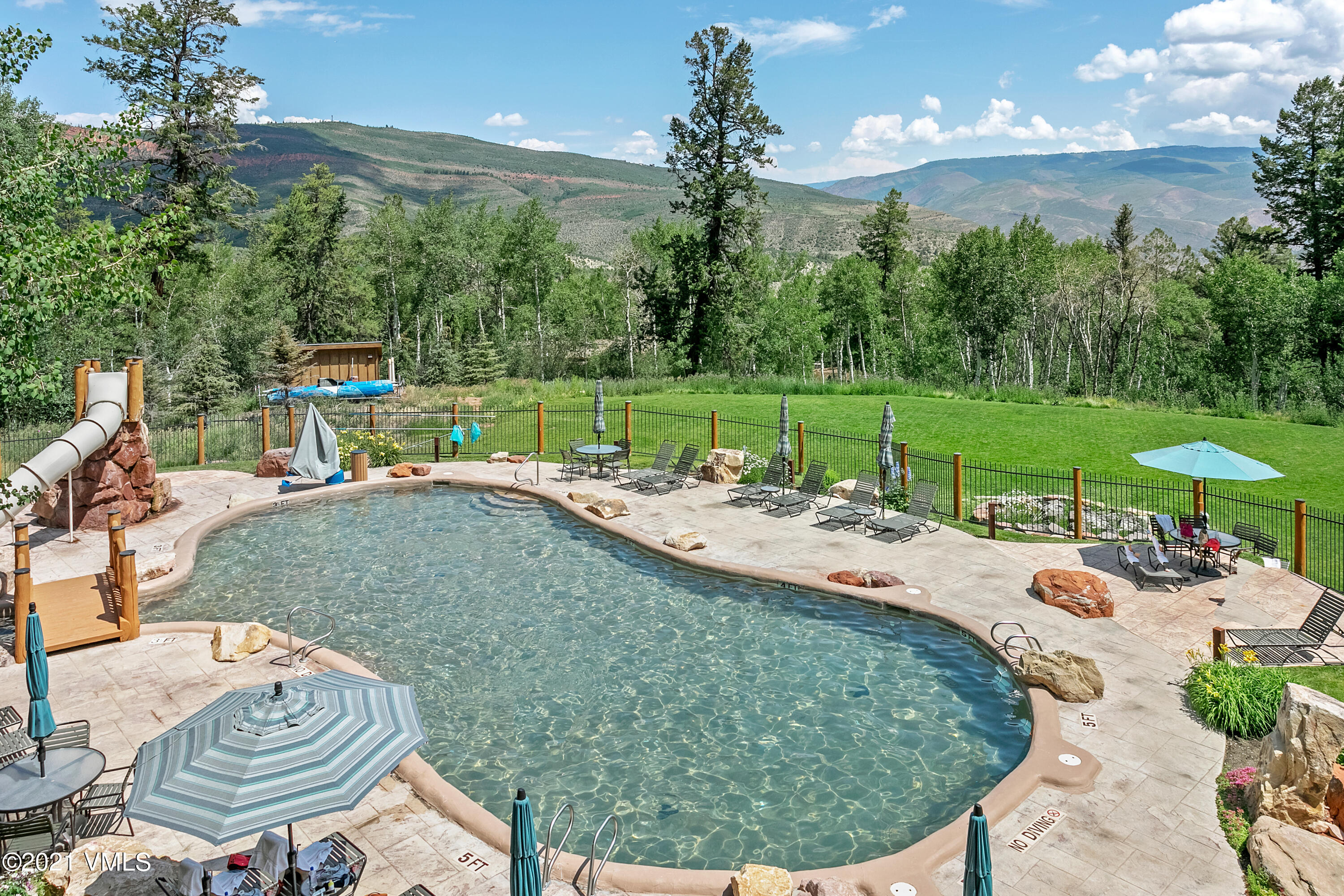 1142 Summit Trail Edwards, CO 81632 - Photo 16 of 17 a view of a swimming pool and lounge chairs