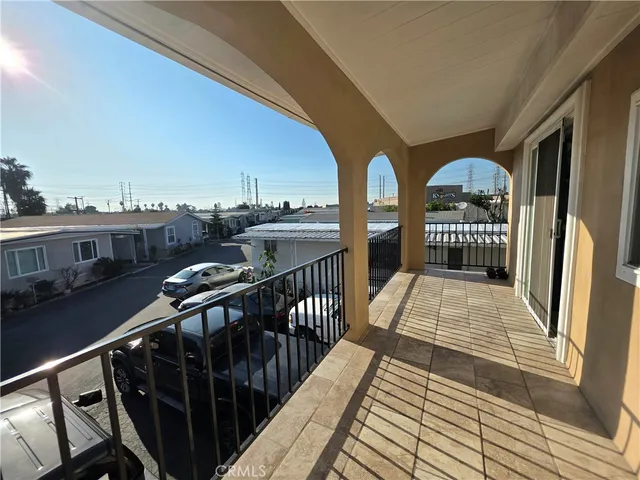a view of balcony with furniture