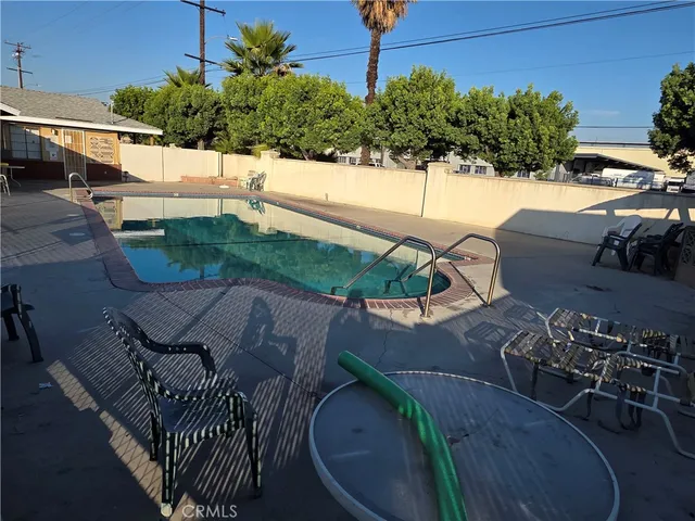 a view of a chairs and table in the patio