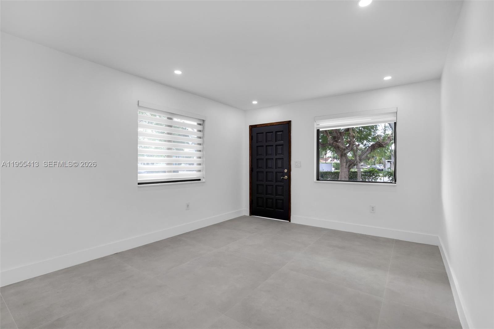 1293 Southwest 22nd Avenue, Unit 1 Miami, FL 33135 - Photo 11 of 28 an empty room with windows
