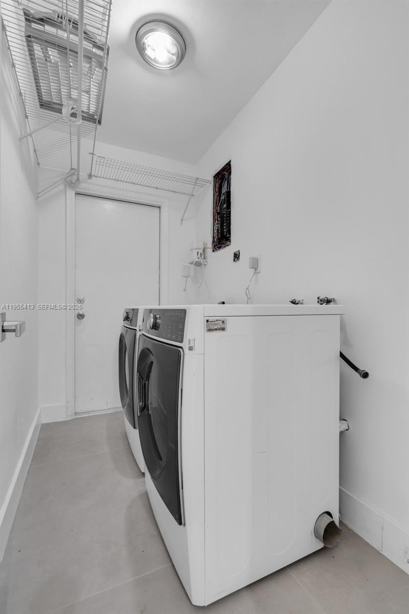 1293 Southwest 22nd Avenue, Unit 1 Miami, FL 33135 - Photo 24 of 28 a utility room with dryer and washer