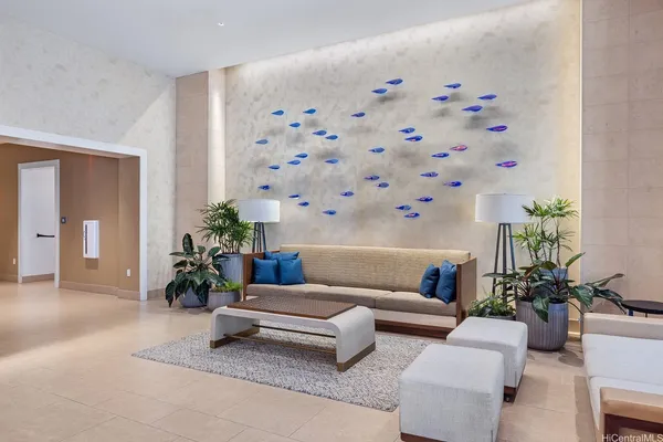 a living room with furniture and potted plants