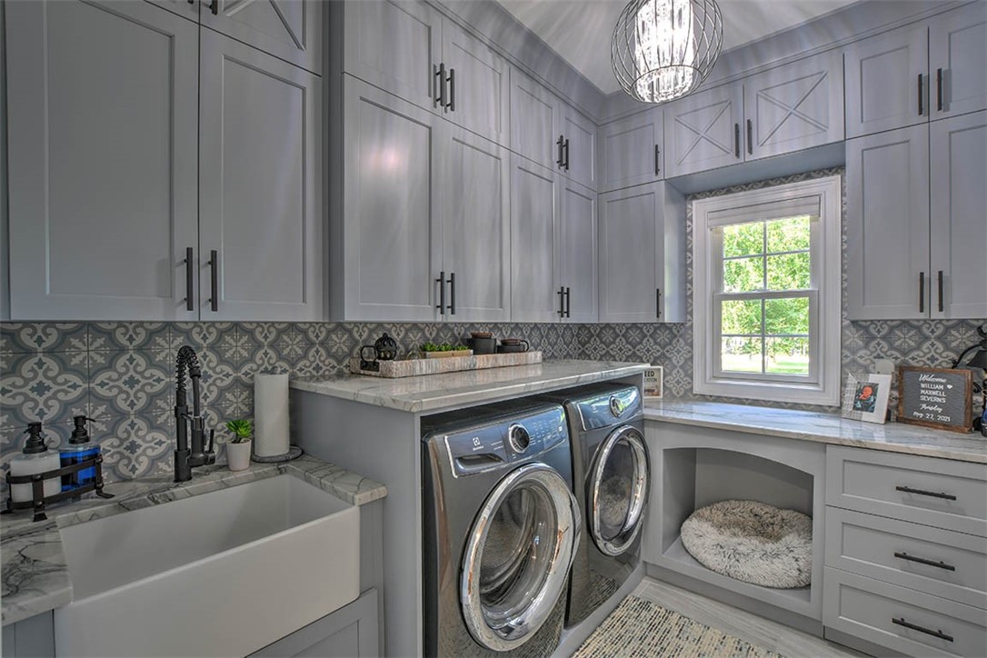 6323 Autumn Ridge Court Decatur, IL 62521 - Photo 22 of 43 a bathroom with a sink a washer and dryer
