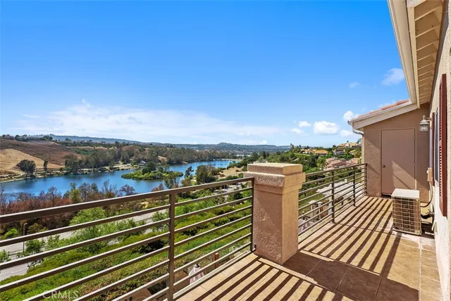 a view of a balcony with wooden floor
