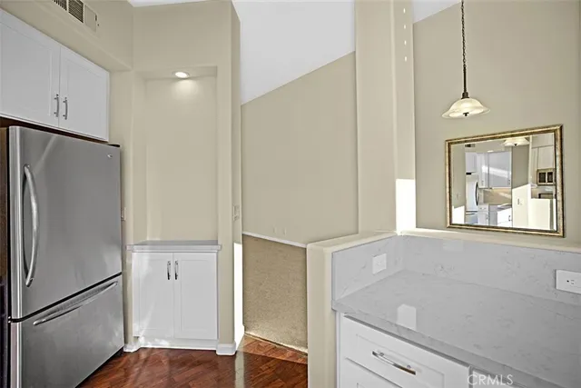 a view of a livingroom with furniture and a flat screen tv