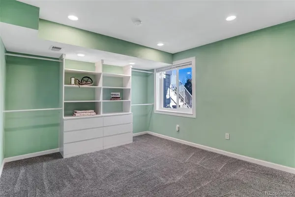 a view of room with window and cabinet
