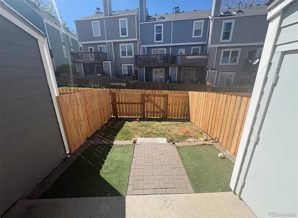 a view of a balcony with wooden floor
