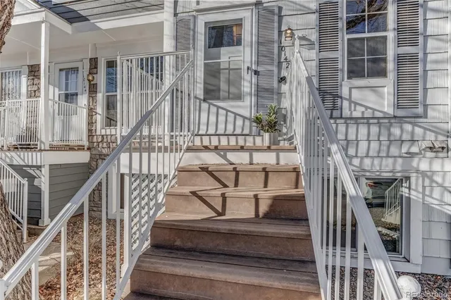 a view of a cars parked on the side of a street