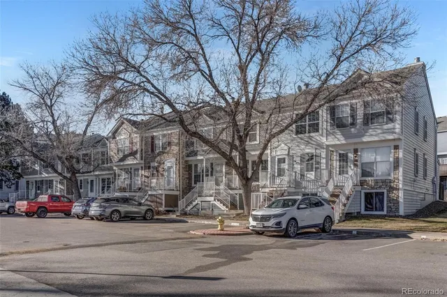 a front view of a building with sitting area
