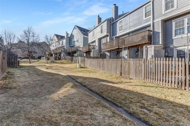a buildings covered with tall trees