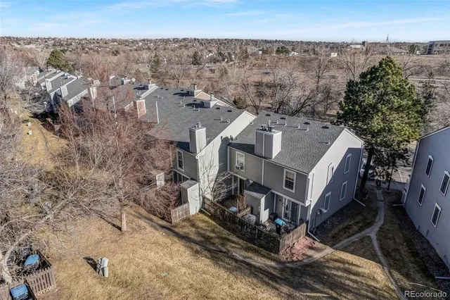 an aerial view of residential house and green space