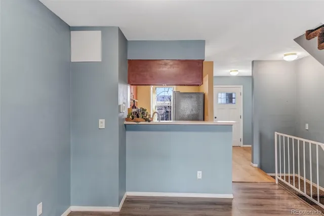 a view of kitchen with window and wooden floor
