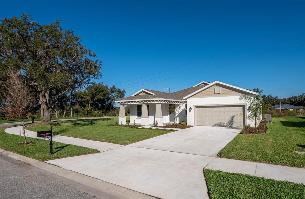 3026 Gator Crossing Place New Port Richey, FL 34655 - Photo 1 of 1 a front view of a house with a yard